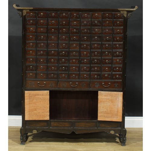 1649 - A Chinese hardwood apothecary chest, pagoda top above eighty-one small drawers and nine further draw... 