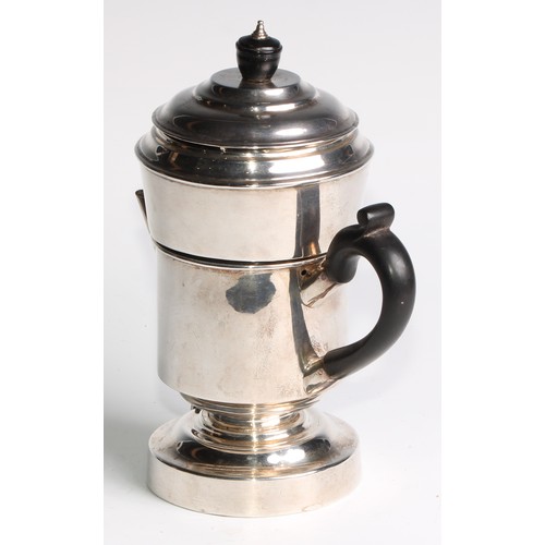 1065 - A silver coffee percolator, of cylindrical form, quite plain, angular spout, stepped domed cover, eb... 