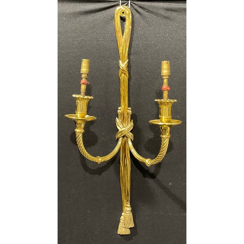 2019 - A harlequin garniature of Louis XVI style brass five-light wall sconces, ribbon crestings, the large... 