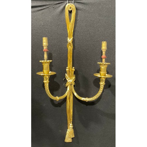 2019 - A harlequin garniature of Louis XVI style brass five-light wall sconces, ribbon crestings, the large... 