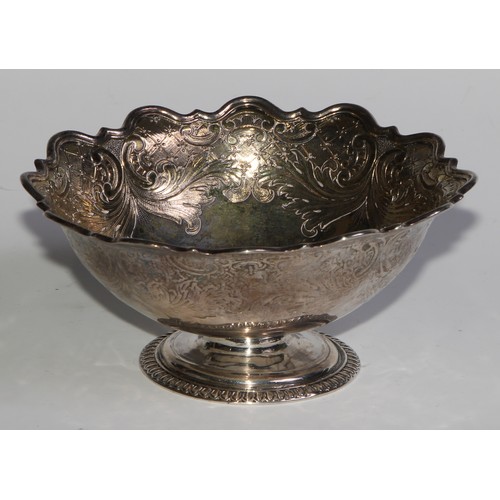 1682 - A Continental silver coloured metal shaped circular pedestal bowl, probably Dutch, chased with scrol... 