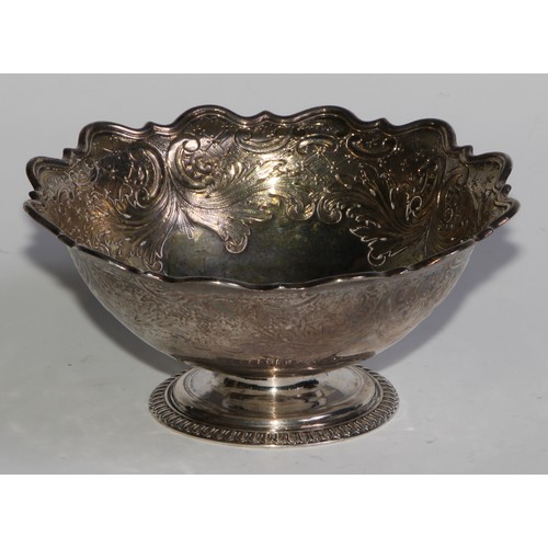 1682 - A Continental silver coloured metal shaped circular pedestal bowl, probably Dutch, chased with scrol... 