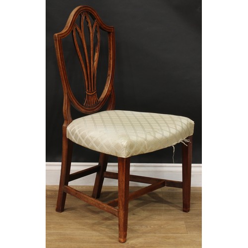 2377 - A set of four Hepplewhite Revival mahogany dining chairs, each splat pierced and carved as Gothic tr... 