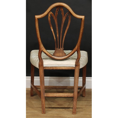 2377 - A set of four Hepplewhite Revival mahogany dining chairs, each splat pierced and carved as Gothic tr... 