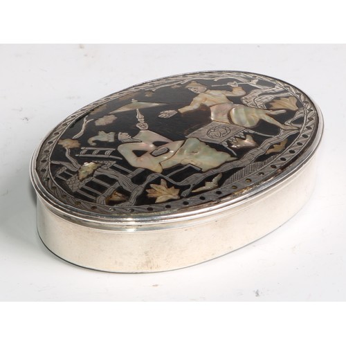 2172 - An 18th century tortoiseshell mounted oval snuff box, hinged cover inlaid in mother of pearl and whi... 