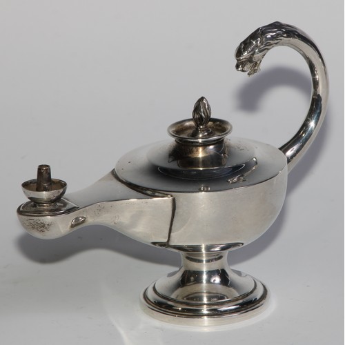 978 - A George V silver table cigar lighter, as a Roman lamp, flying scroll handle terminating in the head... 