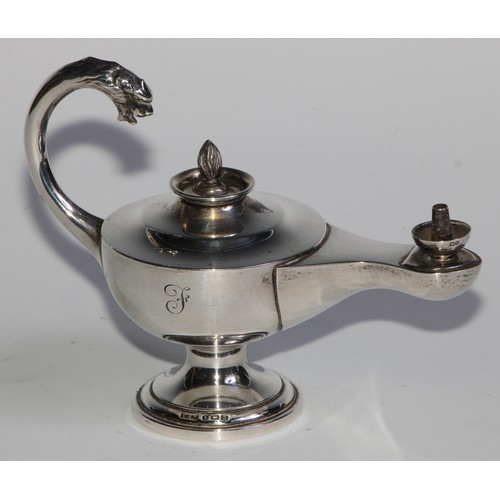 978 - A George V silver table cigar lighter, as a Roman lamp, flying scroll handle terminating in the head... 