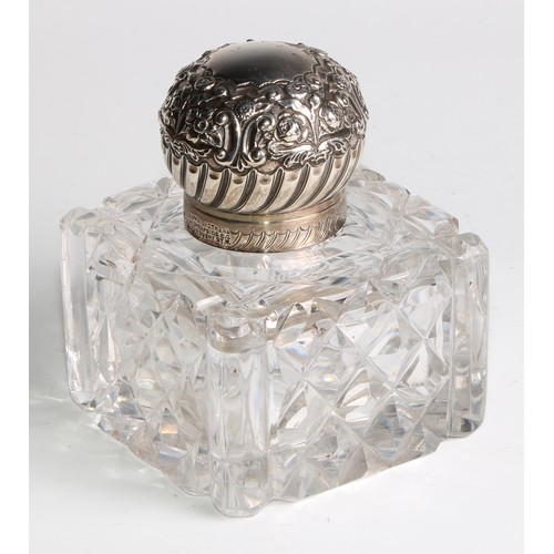 996 - A large Victorian silver mounted glass inkwell, the hinged domed cover chased with flowers and scrol... 