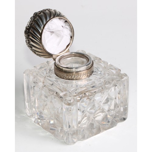 996 - A large Victorian silver mounted glass inkwell, the hinged domed cover chased with flowers and scrol... 