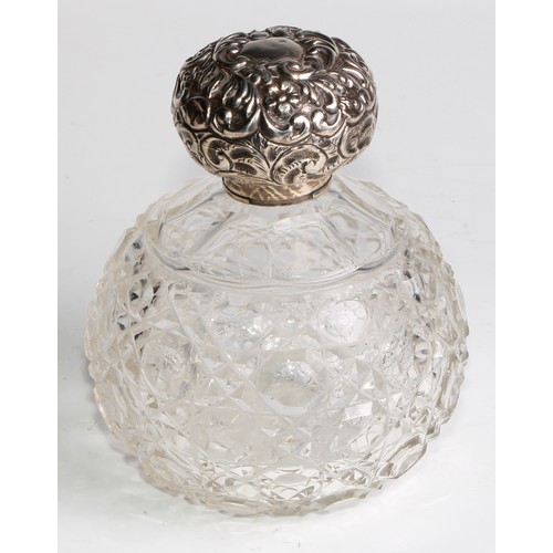 996 - A large Victorian silver mounted glass inkwell, the hinged domed cover chased with flowers and scrol... 