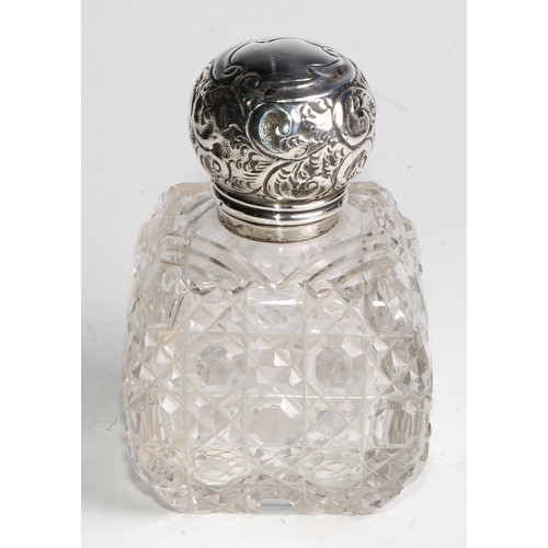 996 - A large Victorian silver mounted glass inkwell, the hinged domed cover chased with flowers and scrol... 