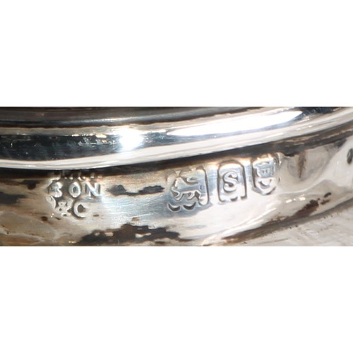 996 - A large Victorian silver mounted glass inkwell, the hinged domed cover chased with flowers and scrol... 