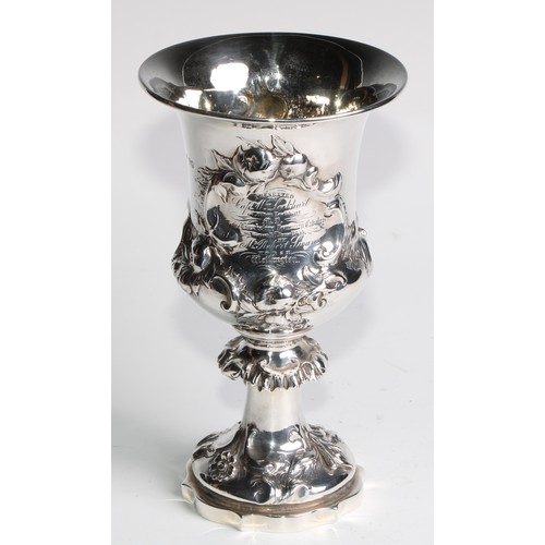 1152 - An early Victorian silver campana goblet, of military interest, chased with a hare coursing scene, f... 