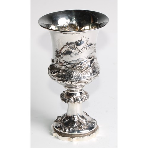 1152 - An early Victorian silver campana goblet, of military interest, chased with a hare coursing scene, f... 