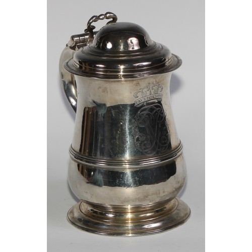 898 - A George II silver bell shaped tankard, hinged domed cover with scroll thumbpiece, S-scroll handle w... 