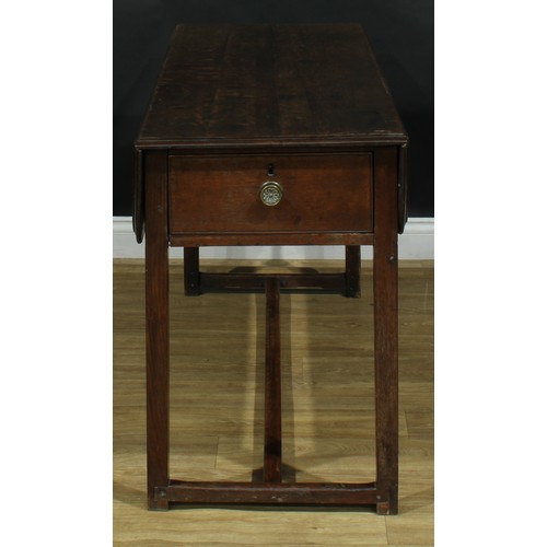 2043 - A George III vernacular oak servants' quarters Pembroke table, rounded rectangular top with fall lea... 