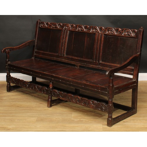 2006 - An 18th century oak settle, possibly Cheshire, shaped cresting rail carved with acanthus flanked by ... 