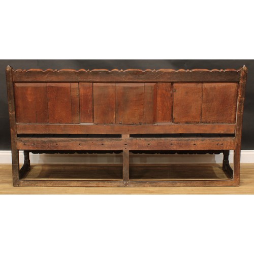 2006 - An 18th century oak settle, possibly Cheshire, shaped cresting rail carved with acanthus flanked by ... 