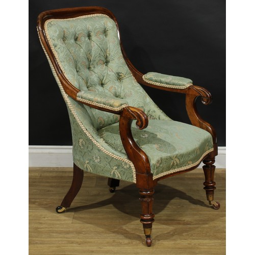 2619 - A William IV rosewood library chair, stuffed-over upholstery, scroll handrests, stylised lotus carve... 