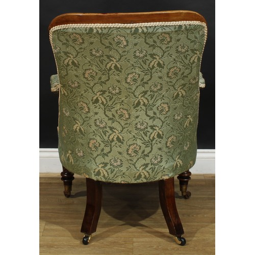 2619 - A William IV rosewood library chair, stuffed-over upholstery, scroll handrests, stylised lotus carve... 