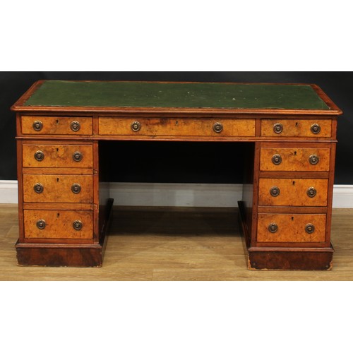 2281 - A Victorian walnut and mahogany twin pedestal desk, rounded rectangular top above three frieze drawe... 