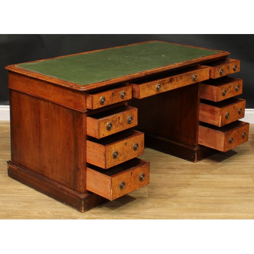 2281 - A Victorian walnut and mahogany twin pedestal desk, rounded rectangular top above three frieze drawe... 