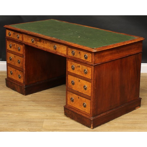 2281 - A Victorian walnut and mahogany twin pedestal desk, rounded rectangular top above three frieze drawe... 