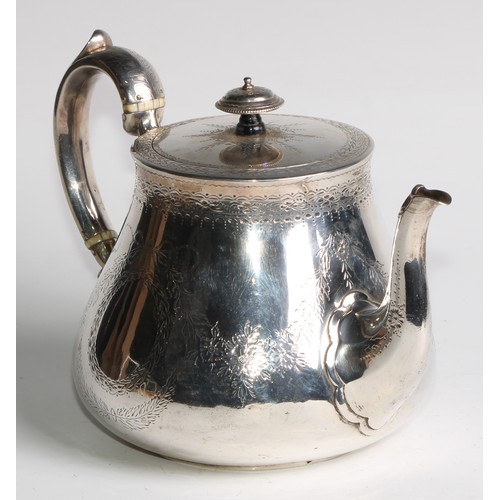 1106 - A Victorian silver teapot, bright-cut engraved and outlined with wrigglework, vacant ribbon-crested ... 