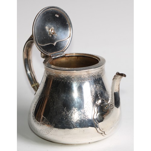 1106 - A Victorian silver teapot, bright-cut engraved and outlined with wrigglework, vacant ribbon-crested ... 