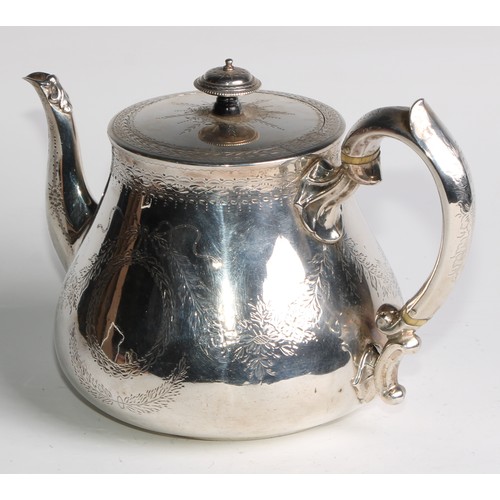 1106 - A Victorian silver teapot, bright-cut engraved and outlined with wrigglework, vacant ribbon-crested ... 