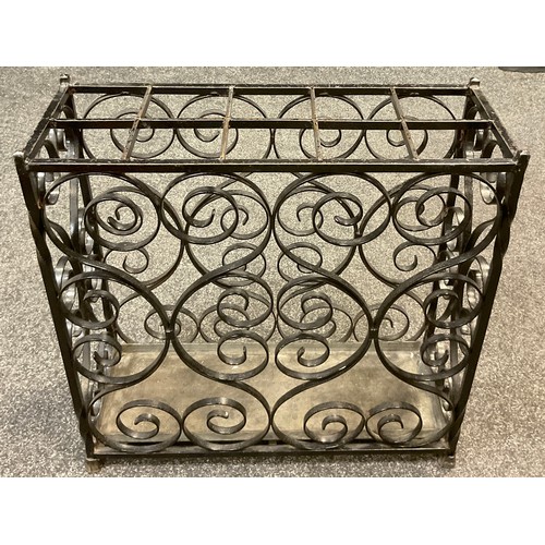 2678 - An early 20th century wrought iron stick / umbrella stand, 61cm high x 61.5cm wide x 23.5cm deep;  a... 