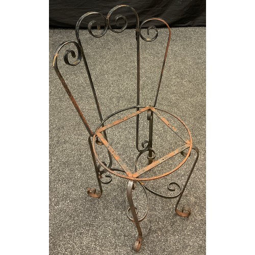 2678 - An early 20th century wrought iron stick / umbrella stand, 61cm high x 61.5cm wide x 23.5cm deep;  a... 