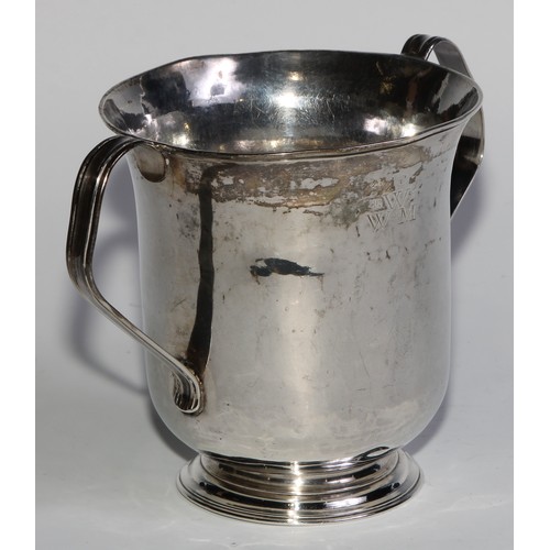 896 - A George II silver bell shaped loving cup, scroll handles, skirted base, 11.5cm high, Thomas Moore I... 