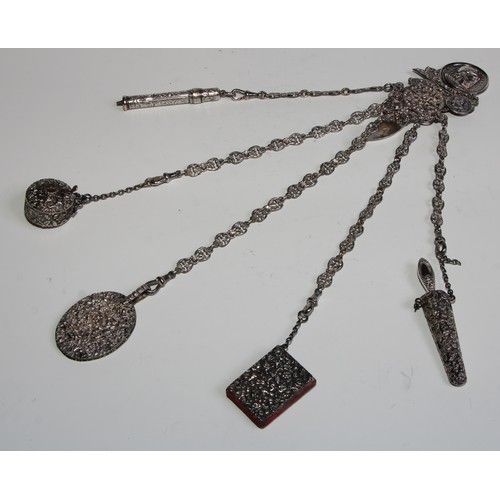 1229 - Sewing - a Victorian silver chatelaine, the clip embossed with a profile portrait after the antique,... 