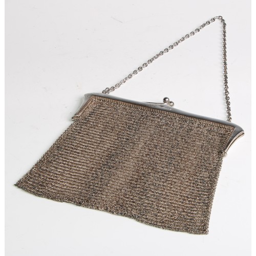 962 - A George V silver mesh evening purse, 16cm wide, London 1922, 216g; another purse, engraved with rib... 