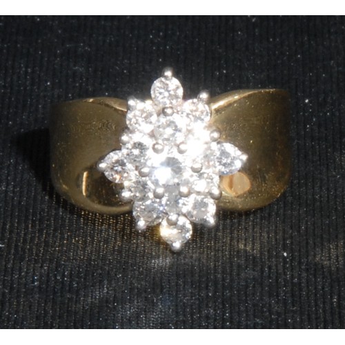 1355 - A diamond and 18ct gold stepped navette shaped cluster ring, the fifteen round brilliant cut claw se... 