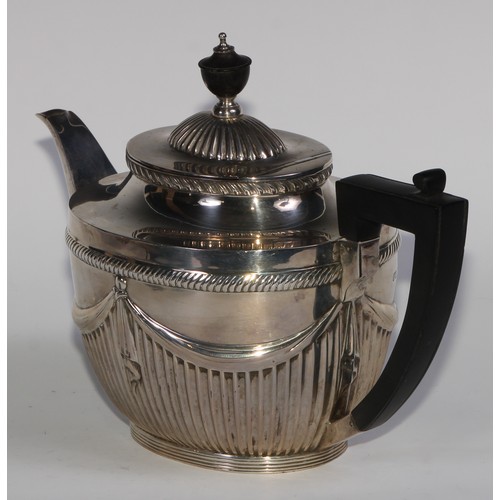 1107 - A Victorian silver three piece half-fluted oval tea service, comprising teapot, milk jug and sugar b... 