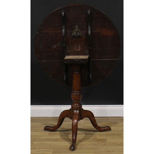 2120 - A George III oak tripod occasional table, circular tilting top, cannon barrel column, cabriole legs,... 