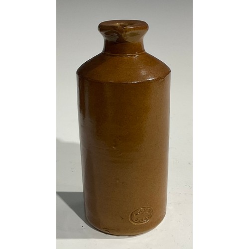 1807 - A mid 19th century two-tone slip glazed slab sealed stoneware porter, applied shaped rectangular sla... 