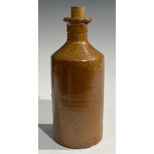 1807 - A mid 19th century two-tone slip glazed slab sealed stoneware porter, applied shaped rectangular sla... 