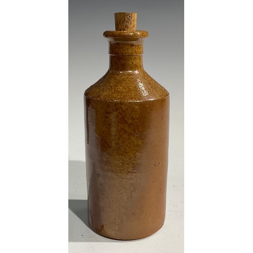 1807 - A mid 19th century two-tone slip glazed slab sealed stoneware porter, applied shaped rectangular sla... 