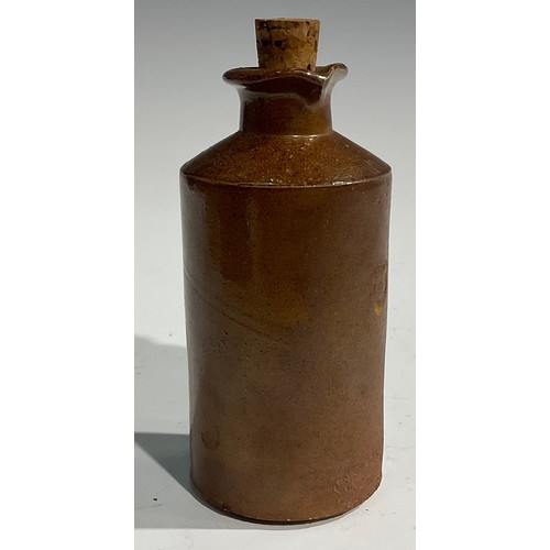 1807 - A mid 19th century two-tone slip glazed slab sealed stoneware porter, applied shaped rectangular sla... 