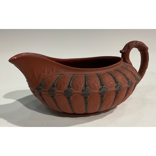 342 - An unusual 19th century Wedgwood Etruscan sauce boat, red moulded body, black sprigged details, impr... 