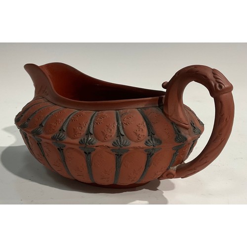 342 - An unusual 19th century Wedgwood Etruscan sauce boat, red moulded body, black sprigged details, impr... 