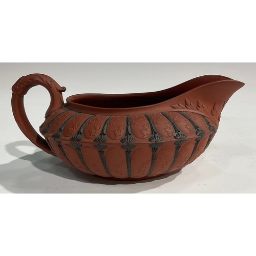 342 - An unusual 19th century Wedgwood Etruscan sauce boat, red moulded body, black sprigged details, impr... 