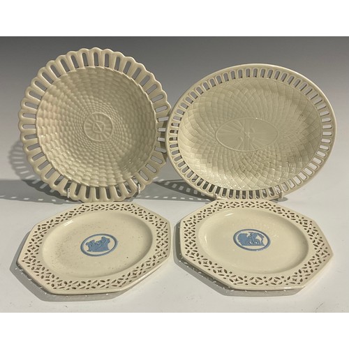 339 - A pair of Wedgwood embossed Queens Ware pierced octagonal plates, 20cm wide; a Wedgwood oval basket ... 