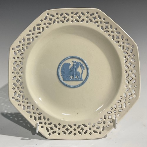 339 - A pair of Wedgwood embossed Queens Ware pierced octagonal plates, 20cm wide; a Wedgwood oval basket ... 