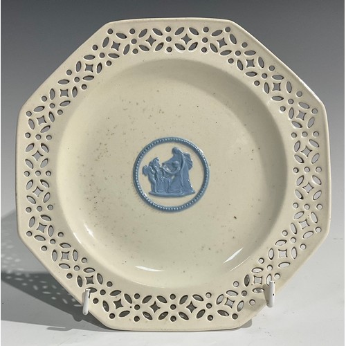 339 - A pair of Wedgwood embossed Queens Ware pierced octagonal plates, 20cm wide; a Wedgwood oval basket ... 