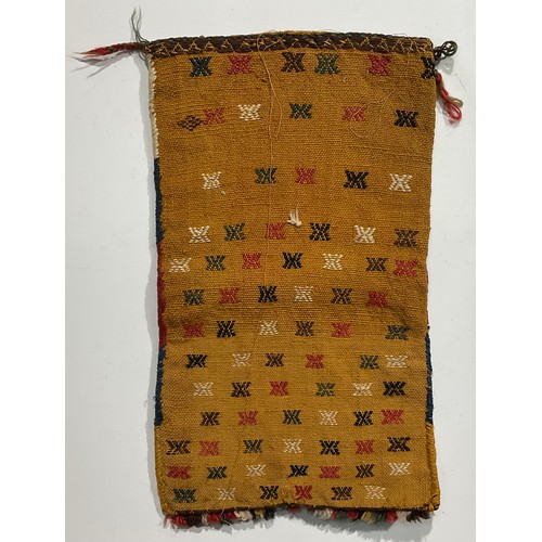 1774 - A Persian Qashqa’i spindle bag, early 20th century, hand-knotted in earthy tones of ochre, brown, wh... 