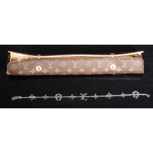 1527 - Designer Jewellery - an 18ct white gold Louis Vuitton monogram bracelet, 22cm long, cased and boxed